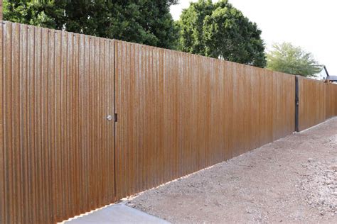 rusted corrugated metal fence